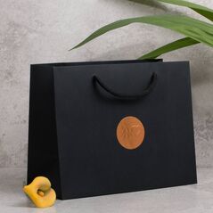 Optional gift wrapping, black gift bag with copper sticker