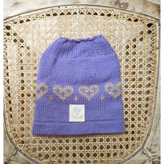 Lilac messy bun hat with fair-isle heart pattern